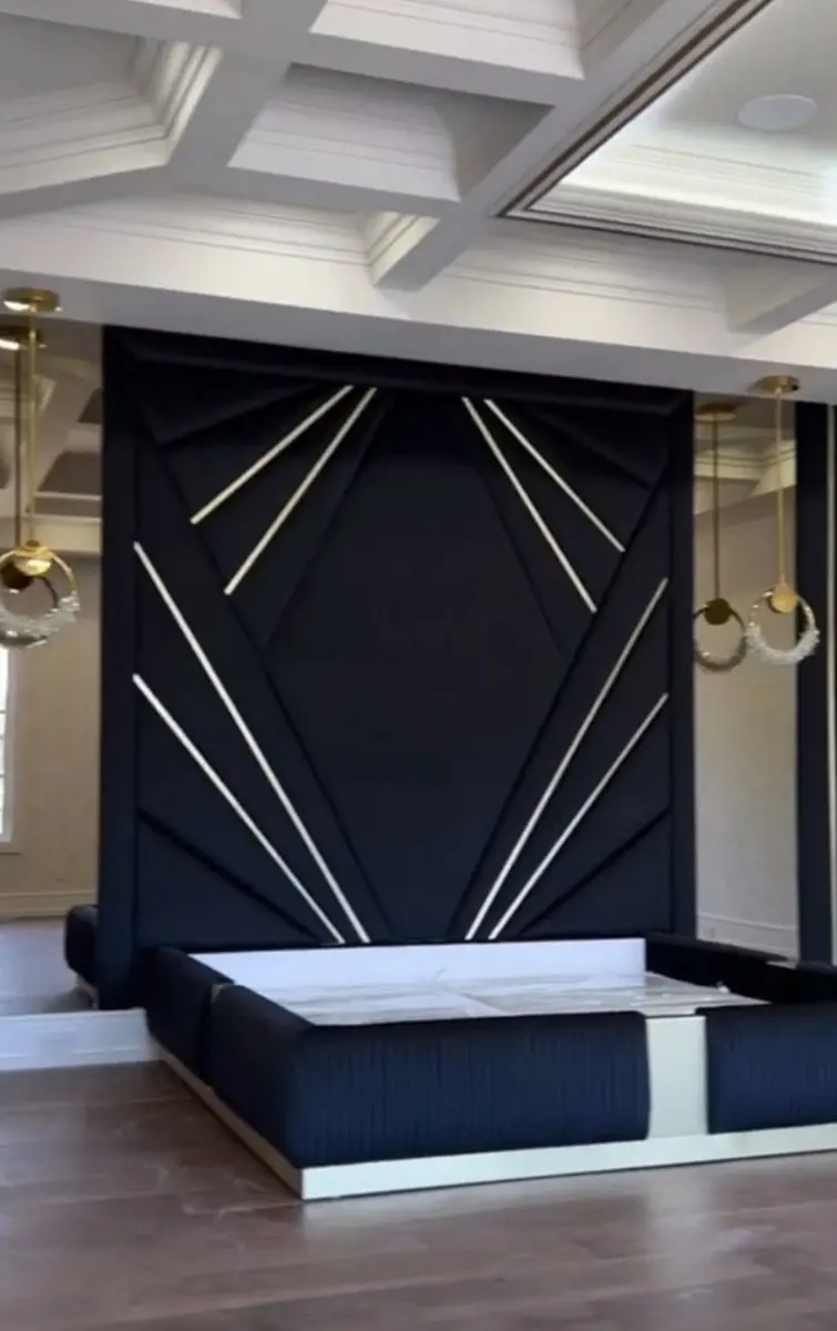 Black Art Deco upholstered feature wall with metallic inlays