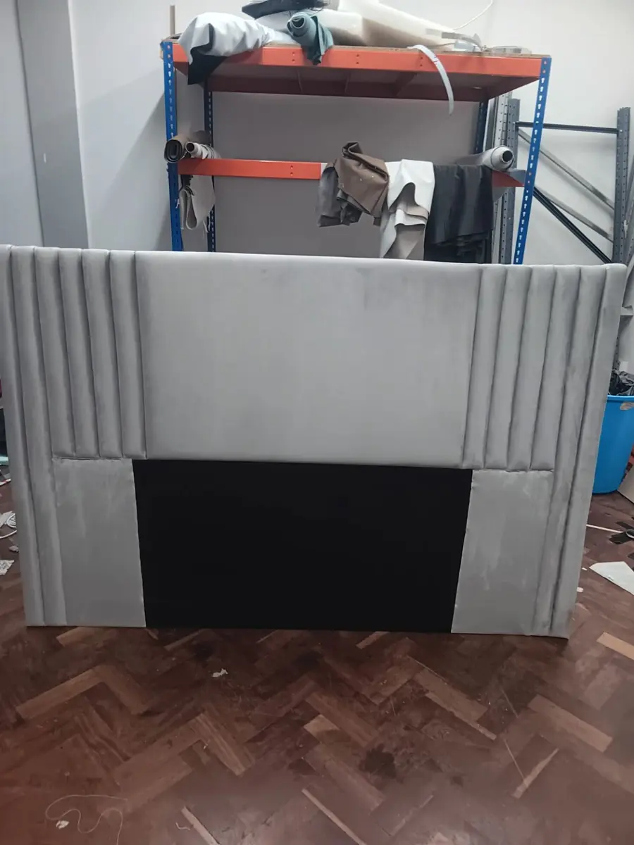 Light grey headboard with a plain centre panel