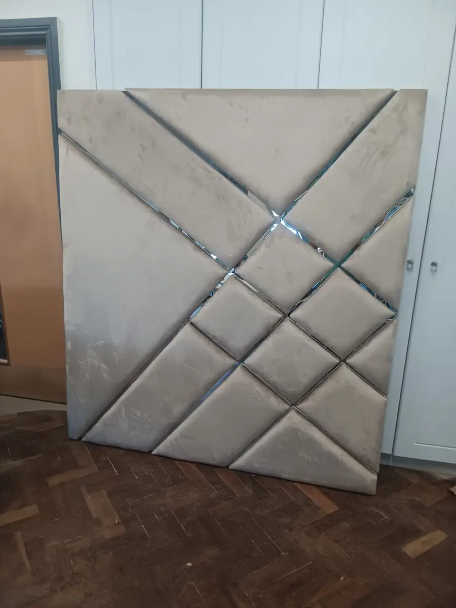 Beige diamond upholstered headboard with reflective trim