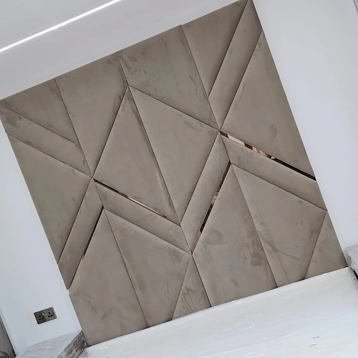 Close view of taupe geometric upholstered panels